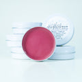 A natural pink cheek and lip balm with tallow and pearl powder for a dewy glow.