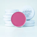 A bright Barbie-pink cheek tint made with tallow and pearl powder for a luminous glow.