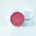 A bronzed cheek and lip tint with pink undertones, enriched with tallow and pearl powder.